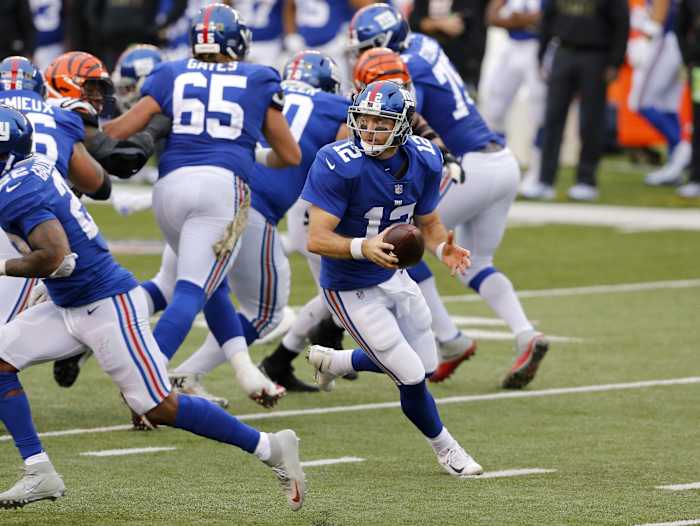 Nov 29, 2020; Cincinnati, Ohio, USA; New York Giants quarterback Colt McCoy (12) runs during the fourth quarter against the Cincinnati Bengals at Paul Brown Stadium.